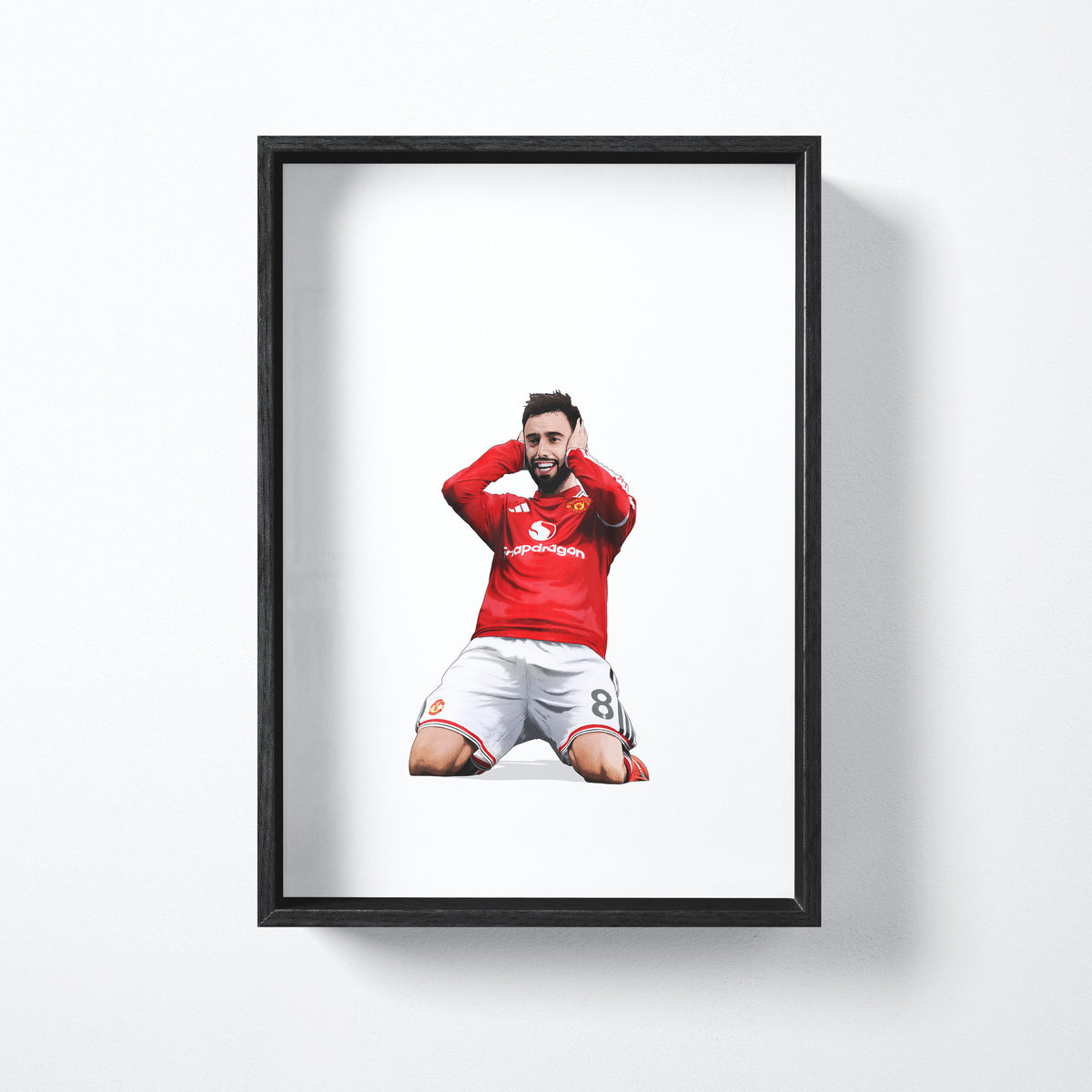 Bruno Fernandes celebration art print shown in a black frame