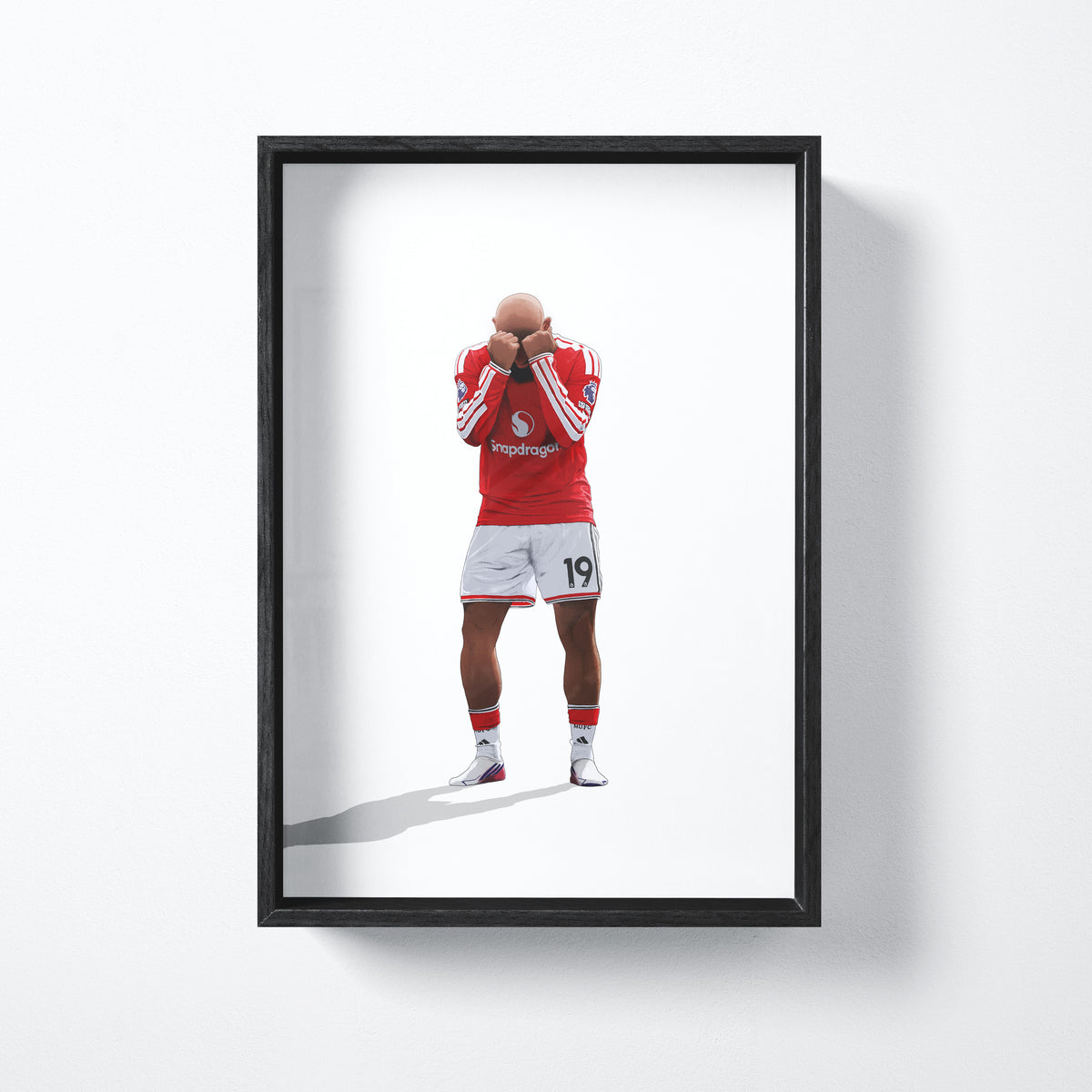 Bryan Mbeumo celebration art print shown in a black frame